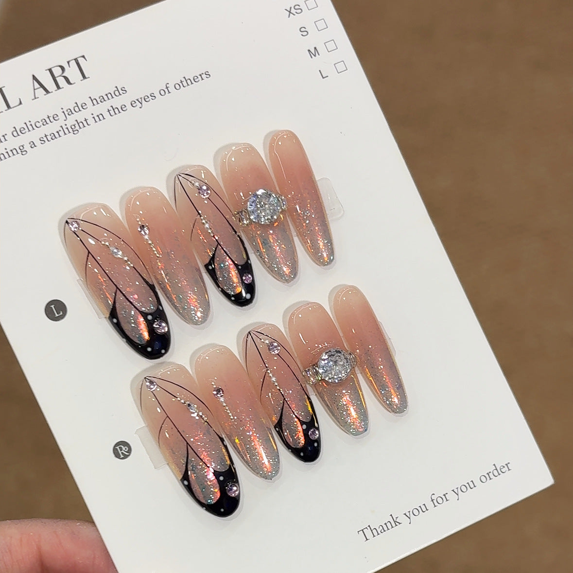 Luxury Jewelry-Inspired Press-On Nails – Sheer Nude Aurora Glitter with Black Line Art & Crystal Ring Accent Almond Nail Set 235