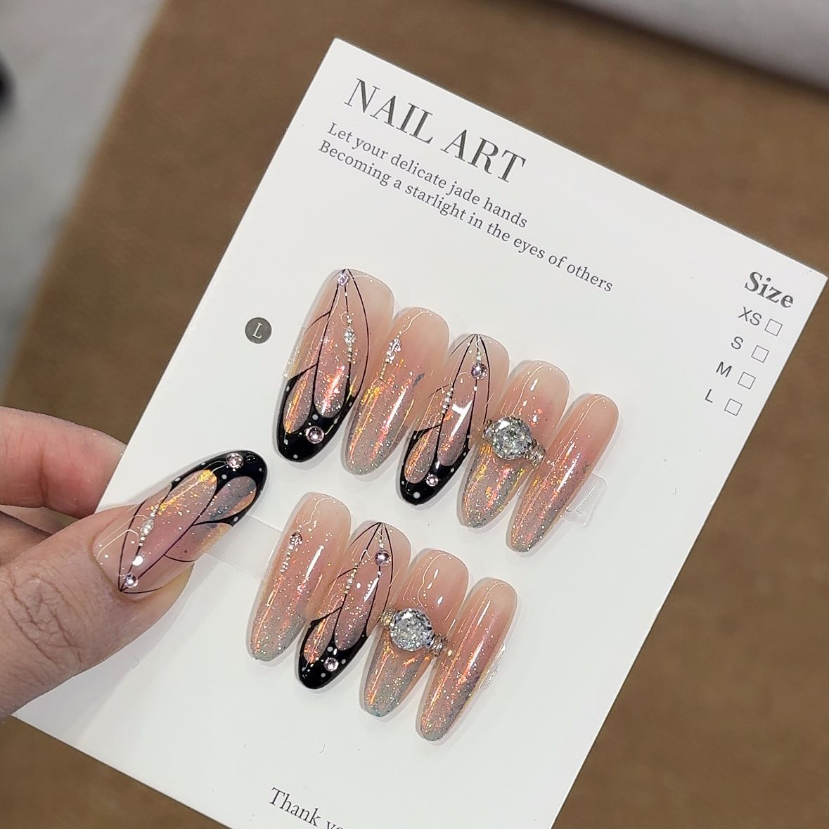 Luxury Jewelry-Inspired Press-On Nails – Sheer Nude Aurora Glitter with Black Line Art & Crystal Ring Accent Almond Nail Set 235